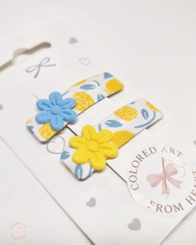 Blonde with Blue Eyes - Set of Two Hair Clips Set of two handmade flower-shaped hair clips in yellow, blue and white.
