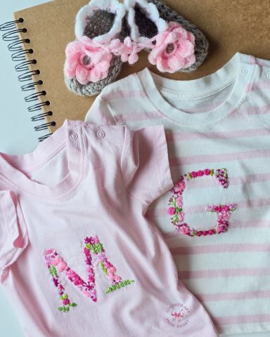 Twin Gardens - Personalised T-shirts for Twin Baby Girls Two soft T-shirts for twin girls, each embroidered with a floral initial