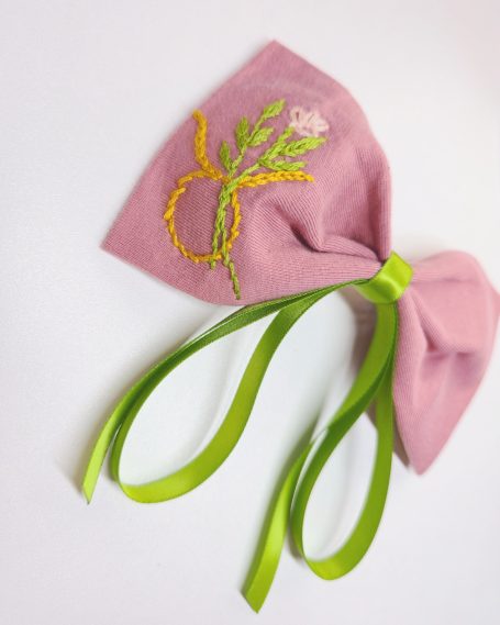 Lovely pink bow with Taurus symbol embroidered and elegant earthy green tails