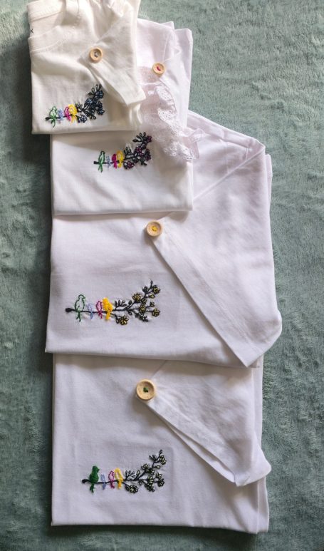 T-shirts for the whole family featuring the same 'birds-on-a-branch' embroidery, adapted for each member: mother, father, daughter, son