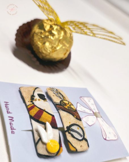 Set of two handmade hair clips made of Harry Potter-inspired fabric.
