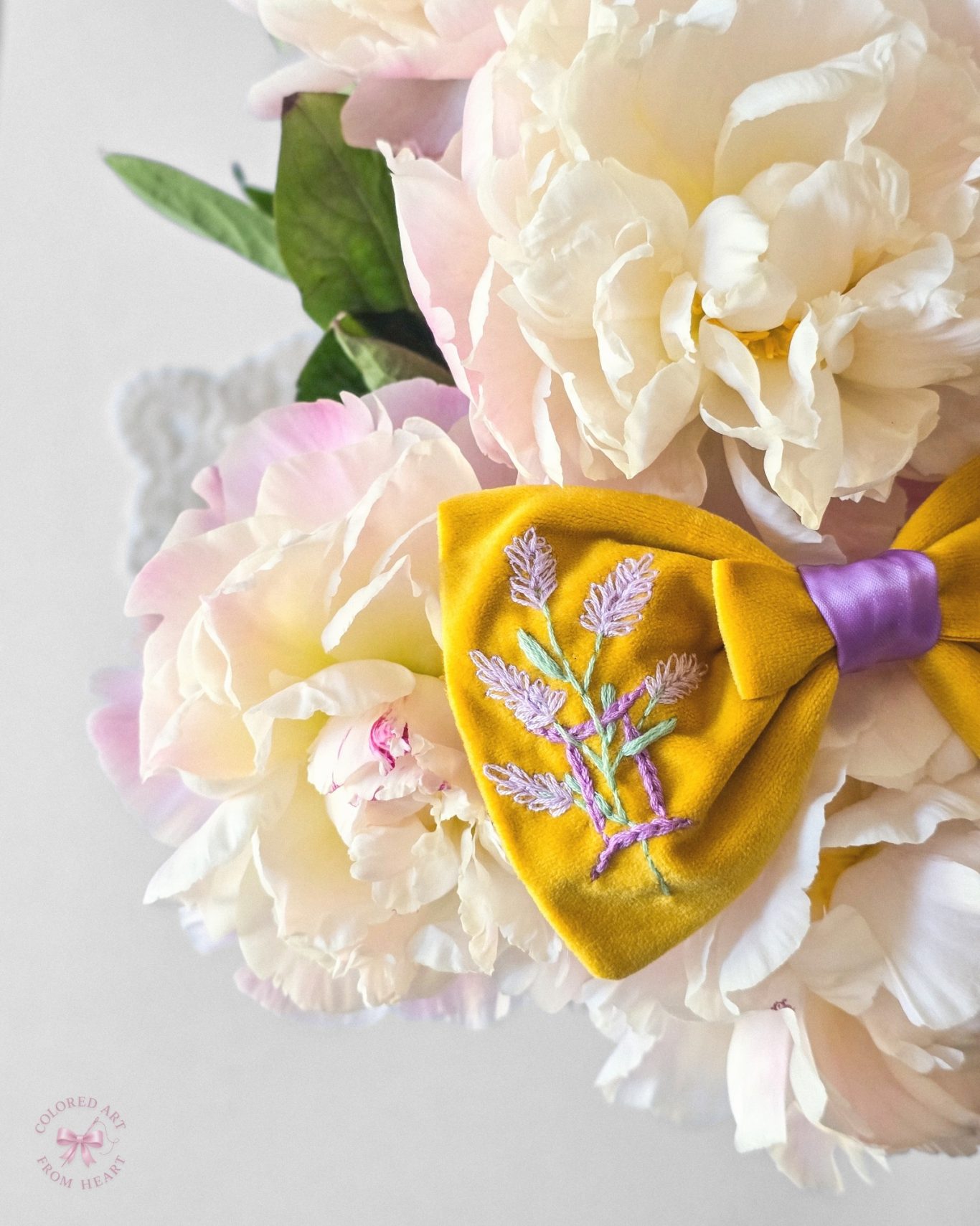 Gemini Bow - Zodiac-Inspired Collection Yellow velvet bow with lilac Gemini symbol and lavender embroidered and soft lilac center.