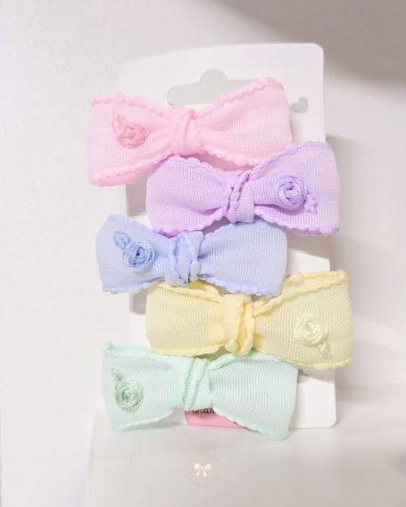 Handmade hair set featuring five pastel mini bows, each embroidered with a matching rose. In pastel pink, lilac, blue, yellow and mint green