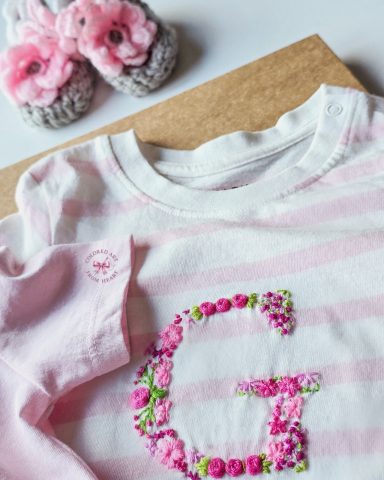 Twin Gardens - Personalised T-shirts for Twin Baby Girls Two soft T-shirts for twin girls, each embroidered with a floral initial