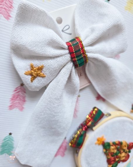 Christmas set including white linen  bow with tartan centre and embroidered Christmas tree and stars, and matching embroidered decoration 