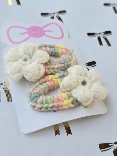 Cheerful Bouquets - Sets of Two Hair Clips Assorted crochet hair clips featuring colourful flower designs.