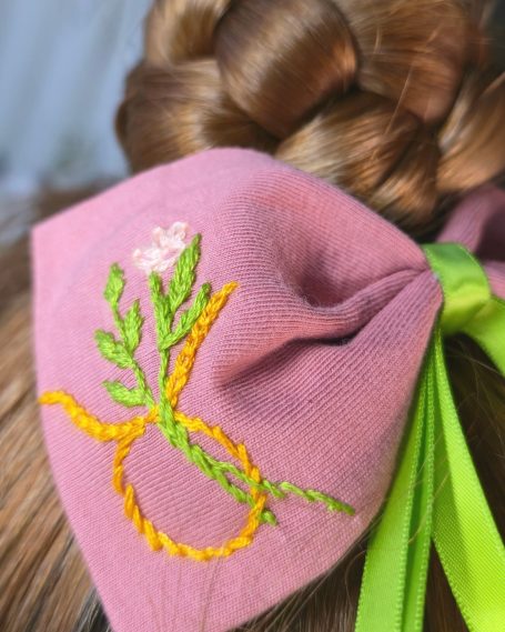 Lovely pink bow with Taurus symbol embroidered and elegant earthy green tails