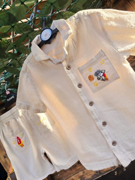 Beige summer outfit for 5-6-year-old boys with embroidered space-themed details (astronaut, rocket, planet, stars)