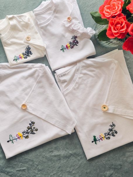 T-shirts for the whole family featuring the same 'birds-on-a-branch' embroidery, adapted for each member: mother, father, daughter, son