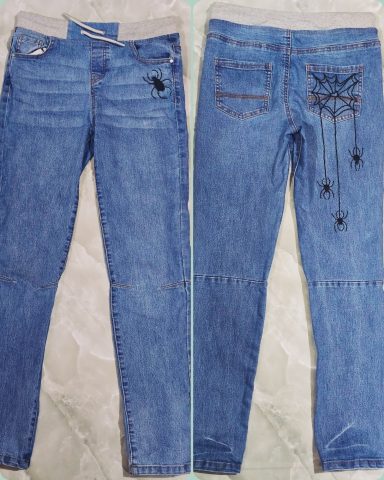 Spider Web - Hand-embroidered Blue Jeans for Women Classic blue jeans customised with handmade spider web embroidery. Featuring a little spider on the front and hanging spiders on the back
